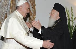 Pope and Patriarch embrace